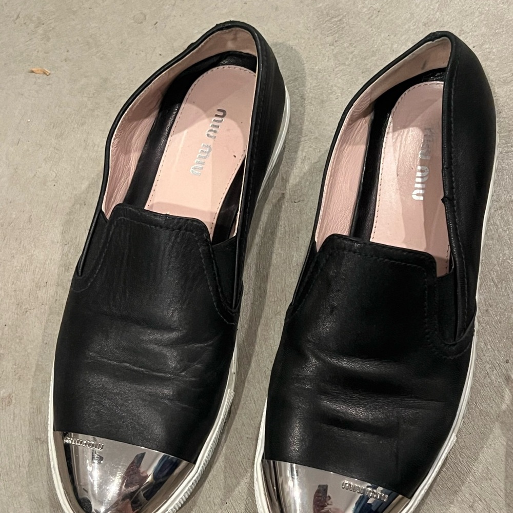 Miu Miu Black and Silver Slip-On Shoes